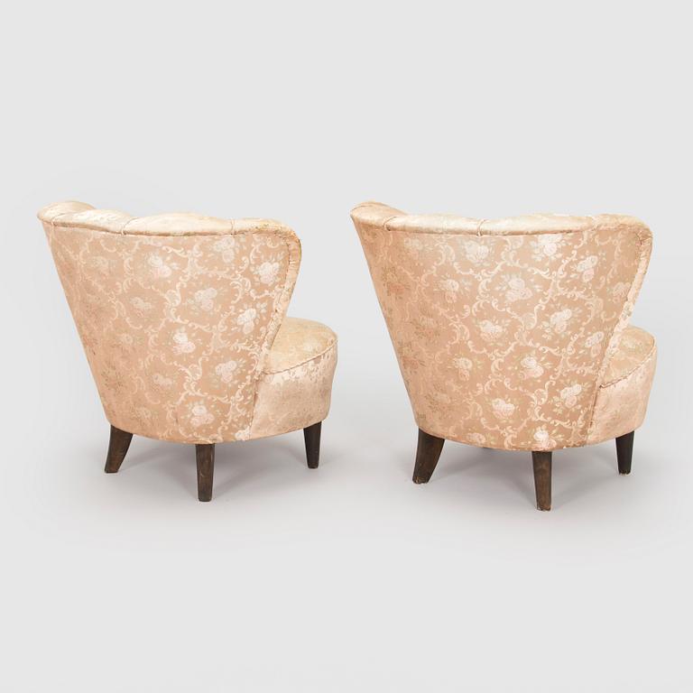 A pair of mid-20th century armchairs.