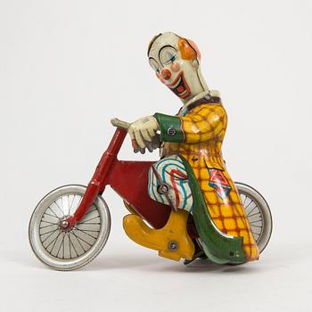 A tinplate Technofix bicycling clown Germany c. 1950.