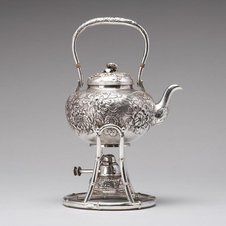 A Japanese silver tea pot with burner and stand, makers mark Samurai Shokai, Yokohama, Sterling.