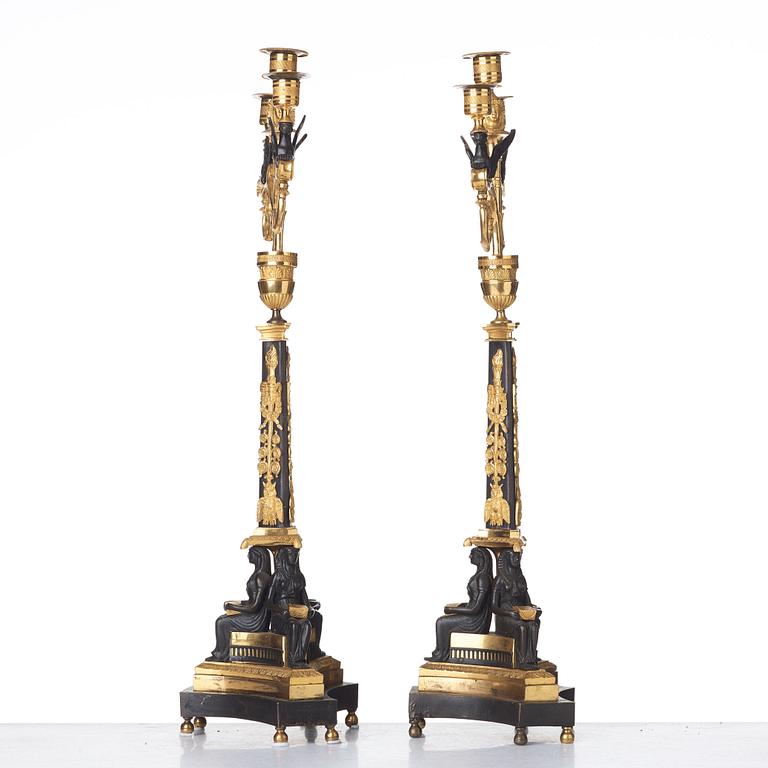 A pair of three-light Empire candelabra, early 19th century .