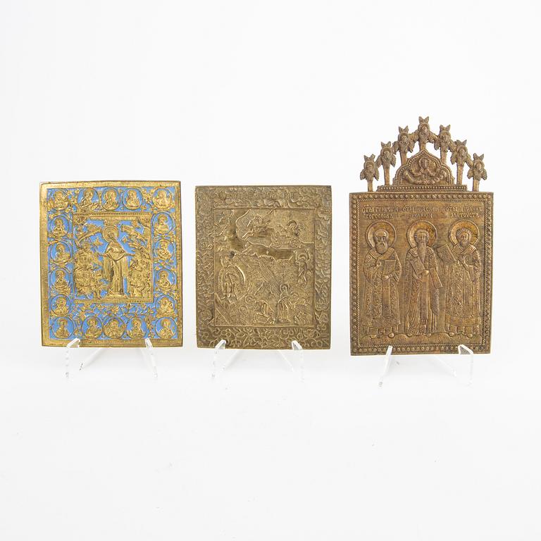 A set of four Russian brass and enamel icons 19th century or older.