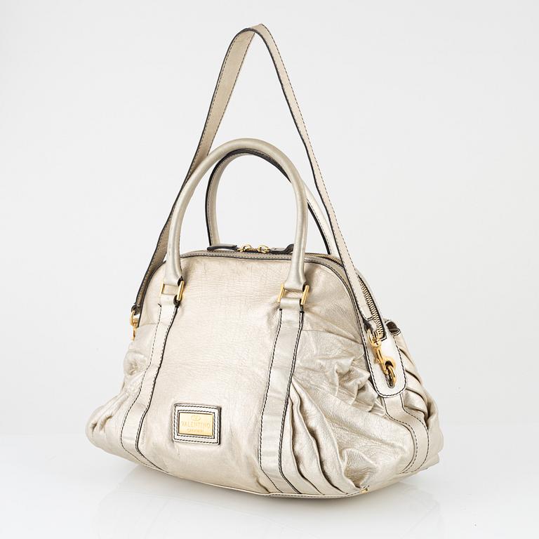 Valentino Garavani, A metallic leather bag.