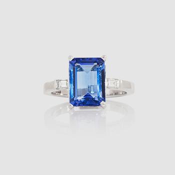 1284. A 4.04 ct tanzanite ring set with diamonds, total carat weight 0.22 ct.