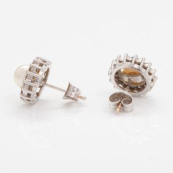 A pair of 14K white gold earrings with diamonds ca. 0.32 ct in total and culturd pearls. Bucherer.