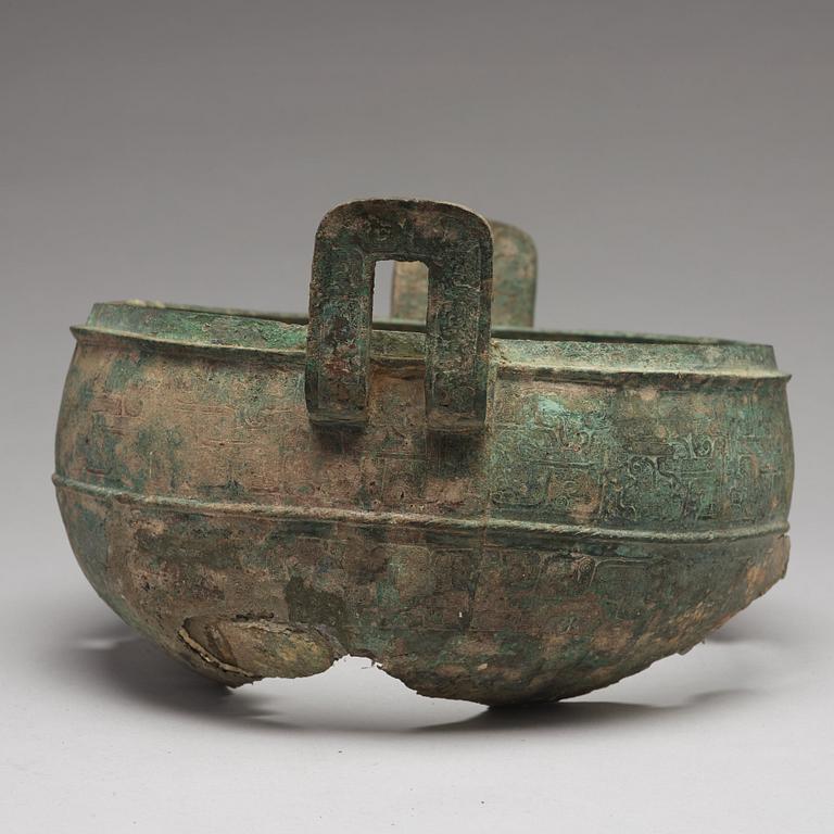 A bronze tripod food vessel and cover, "Ding", Eastern Zhou Dynasty.