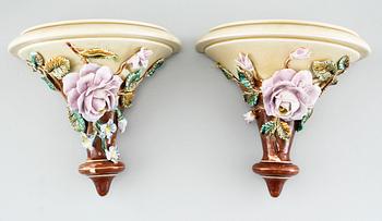 A pair of consoles, a pot and a jardinière in majolica, made by Gustavsberg and Rörstrand around year 1900.