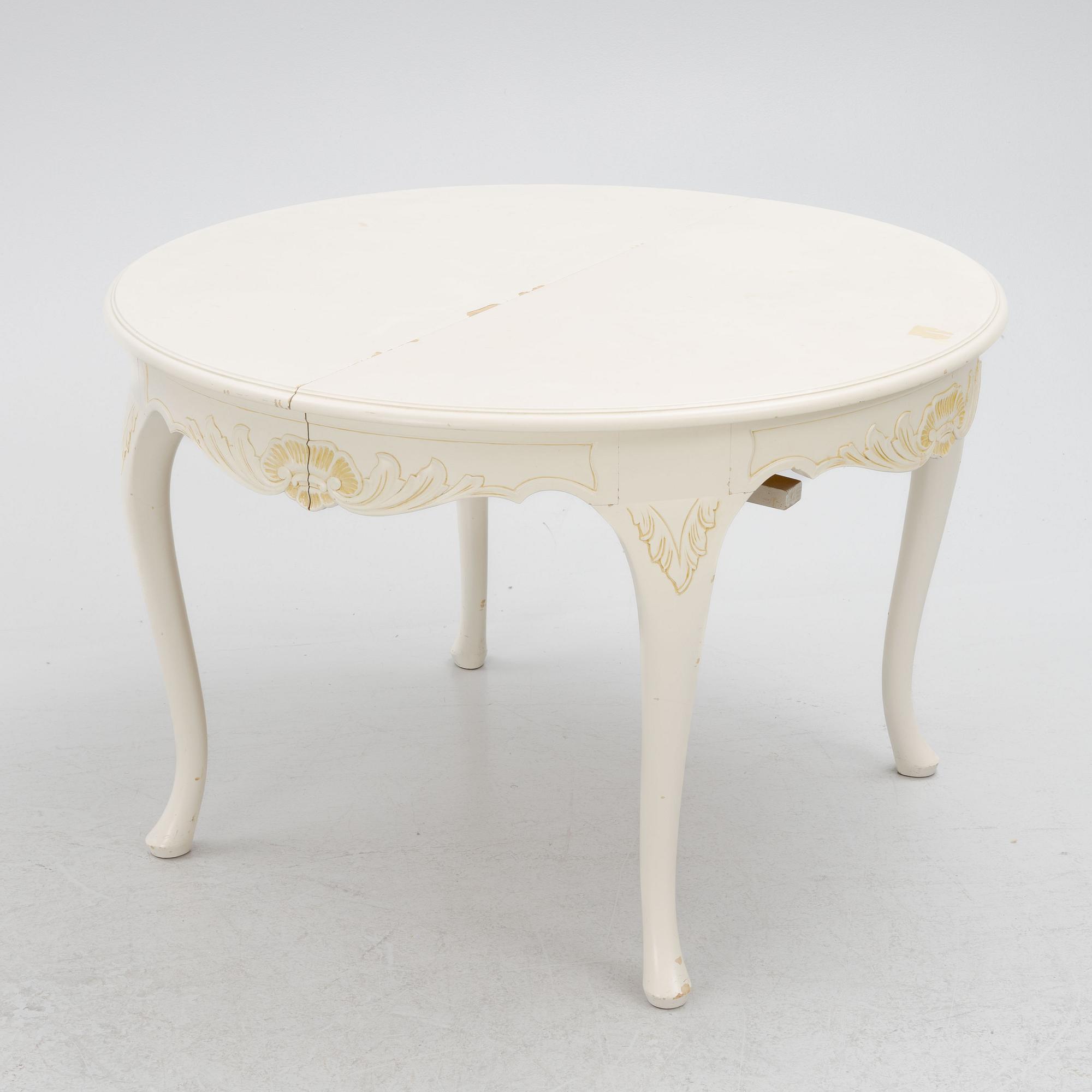 A Rococo style dining table with eight chairs, second half of the 20th century.