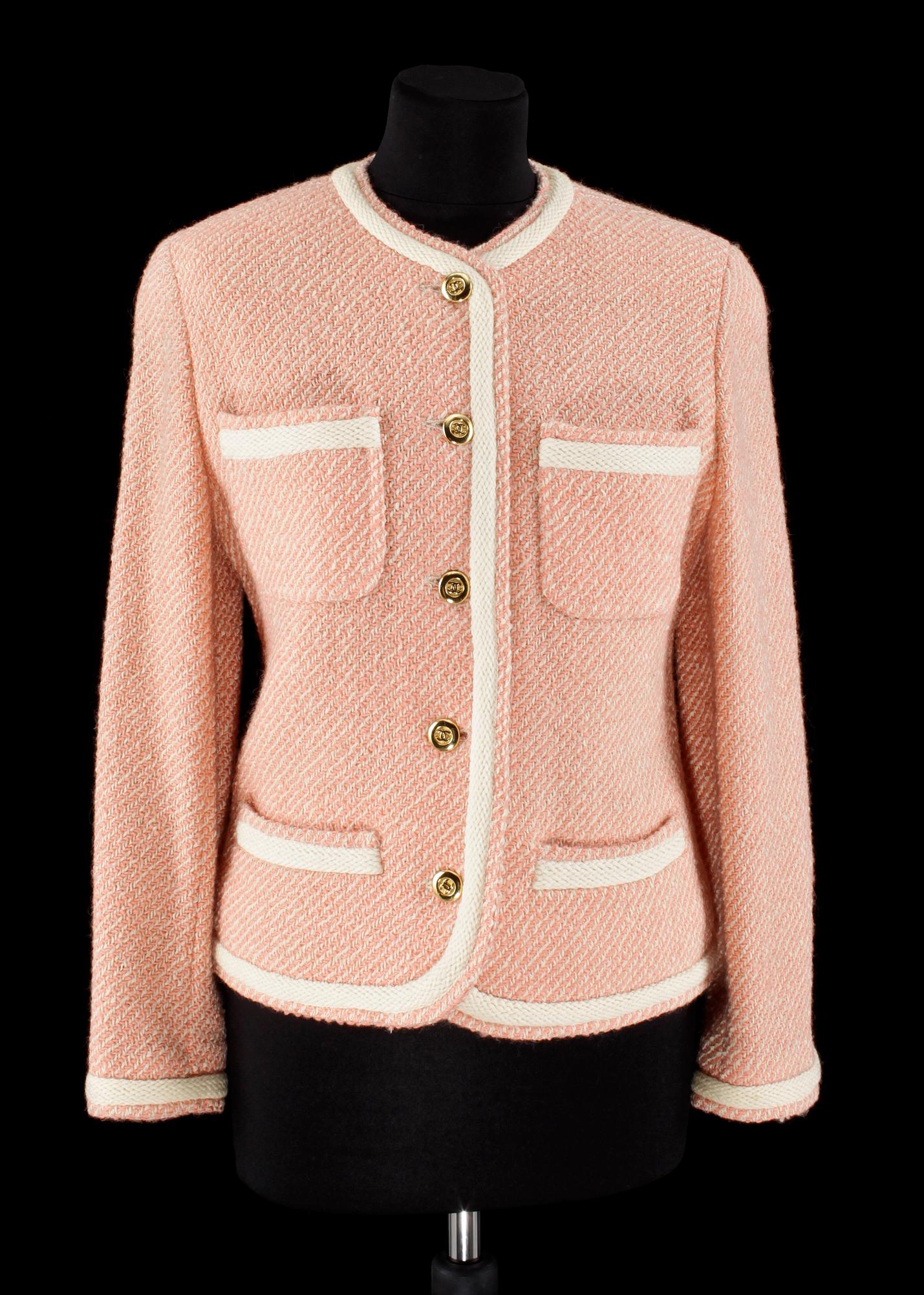 A pink/white bouclé jacket by Chanel.