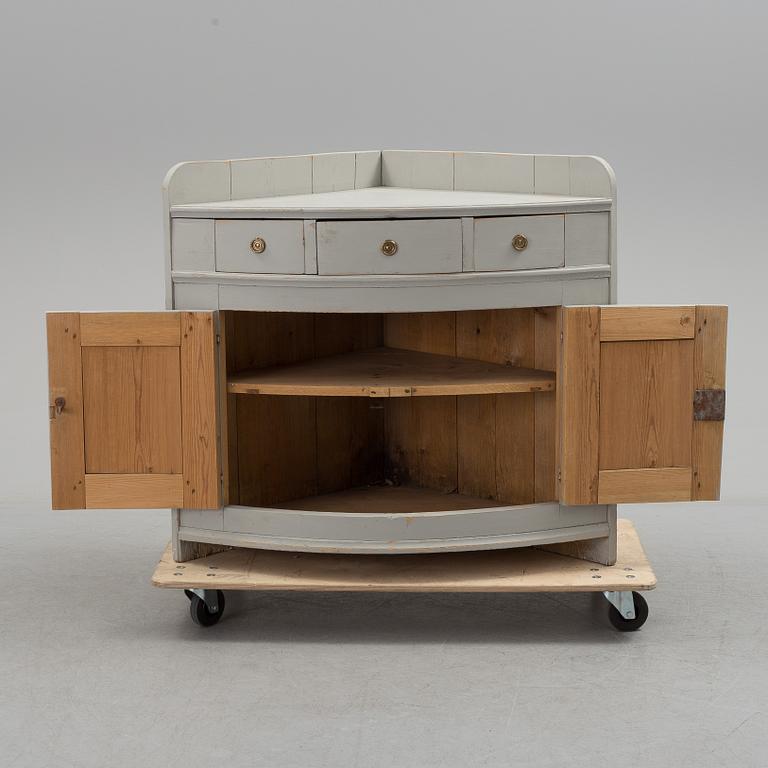 A mid 19th century corner sideboard.