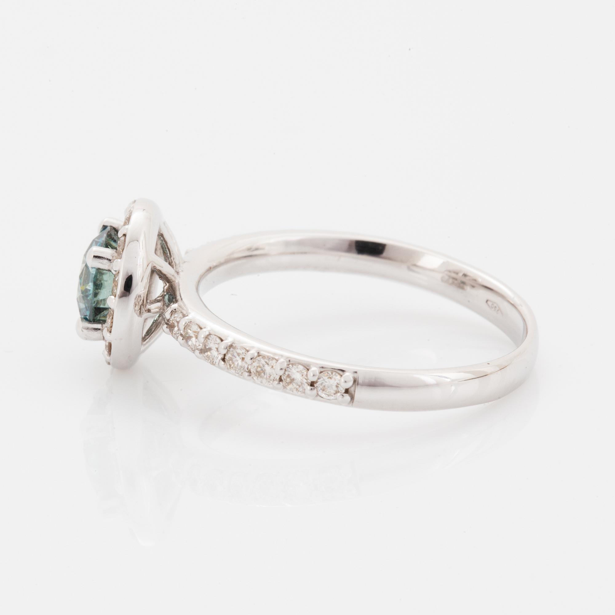 Ring, med briljantslipad blå färgbehandlad diamant.