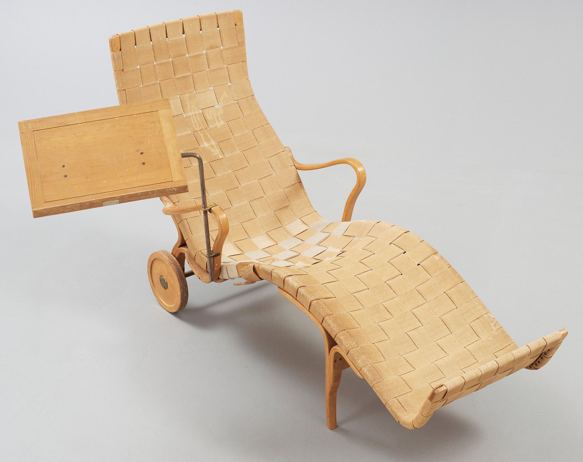 A Bruno Mathsson Swedish Modern chair with attached reading table, Karl Mathsson, Värnamo 1944.