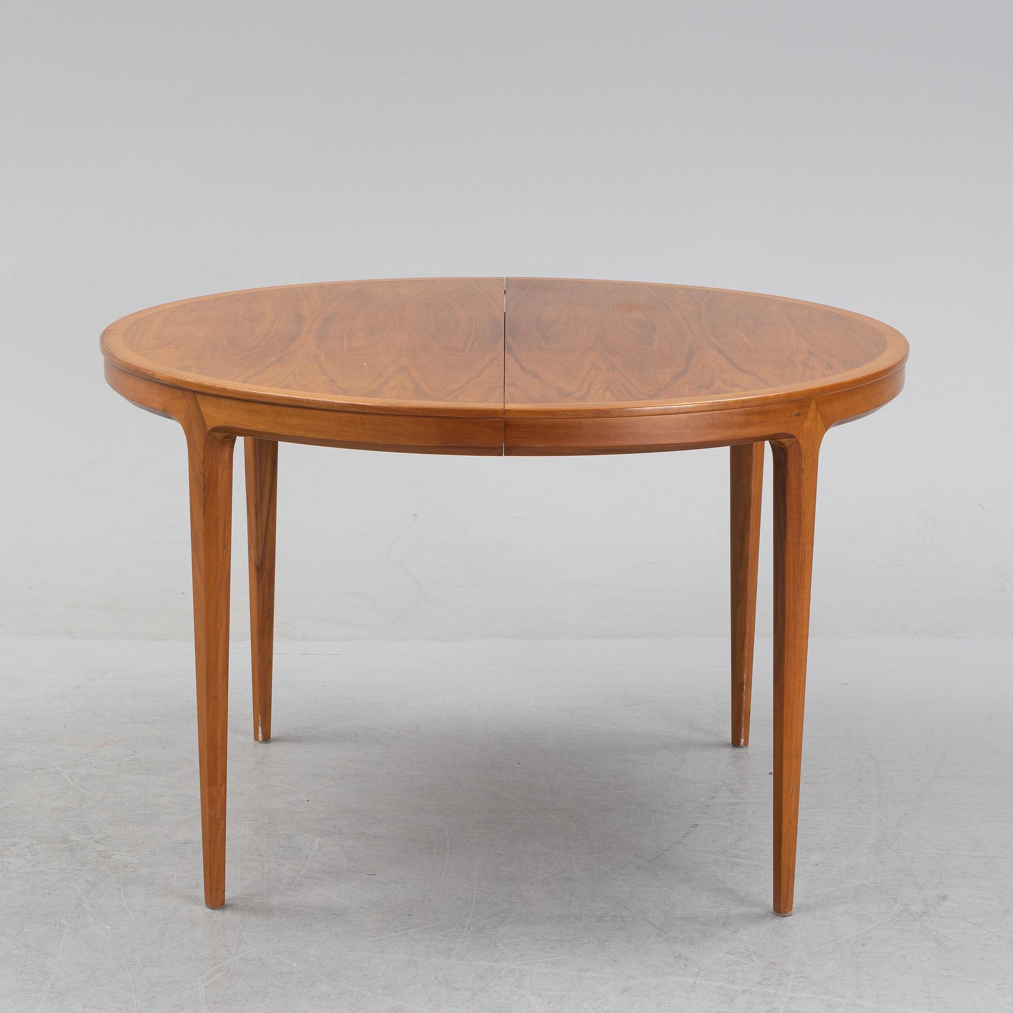 Bertil Fridhagen, a 'Diamant' walnut veneered dining table, with four additional leaves.  Bodafors.