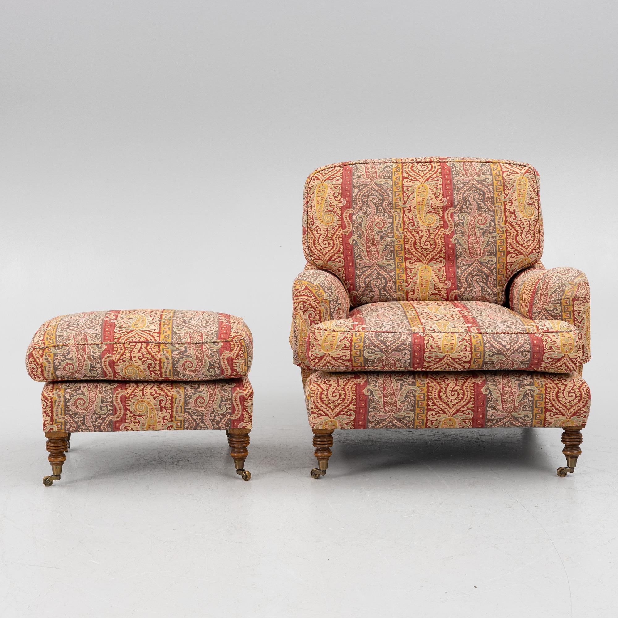 A Howard armchair with ottoman.