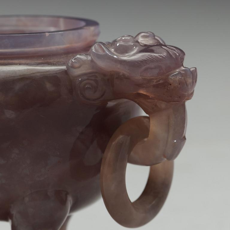 An amethyst tripod censer with cover, China, early 20th Century.