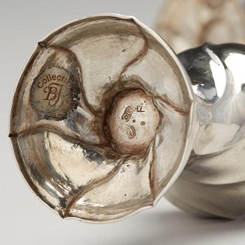 A matched pair of Swedish Rokoko silver sugar-casters, one marked Olof Gravander, Kristinehamn 1764, one a later copie.