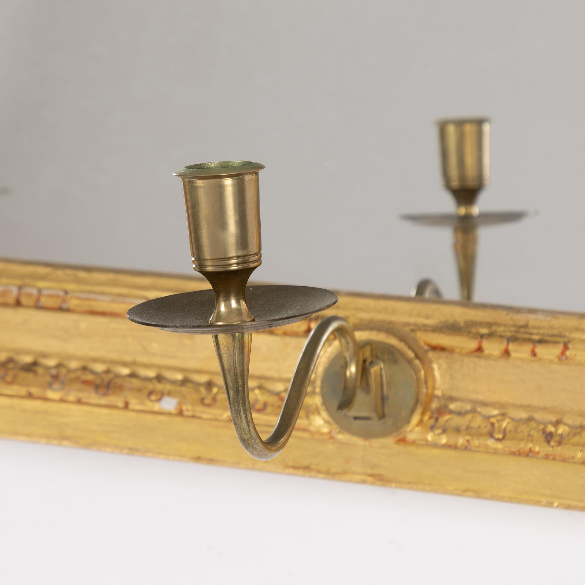 A "Meunier" mirror wall lamp from IKEA's 18th-century series, late 20th century.