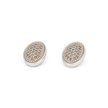 579. BURBERRY, a pair of silver colored clip earrings.