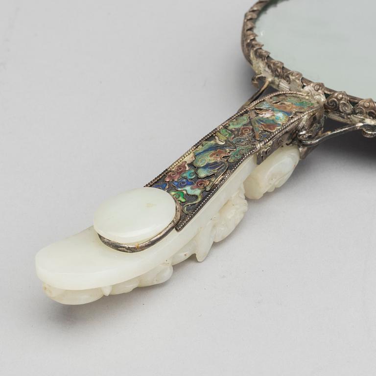 A Chinese silver mirror with carved nephrite placque and belt hook, early 20th Century.