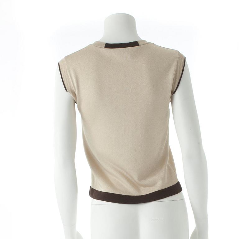 CHANEL, ett tröjset bestående av topp samt cardigan.