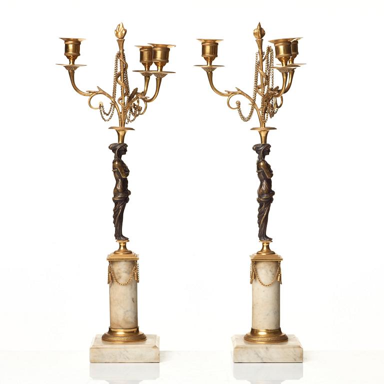 A pair of late Gustavian circa 1800 three-light candelabra.