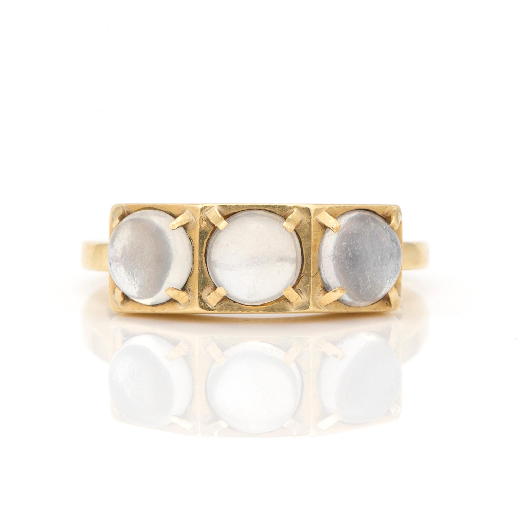 A ring by Wiwen Nilsson set with round, cabochon-cut moonstones.n.