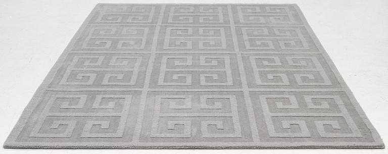 A 'Cubes' carpet, Layered, c. 270 x 180 cm.
