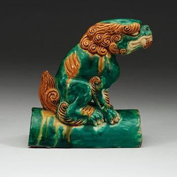 A sancai glazed roof tile figure of a mythological animal, Ming dynasty, 17th Century.