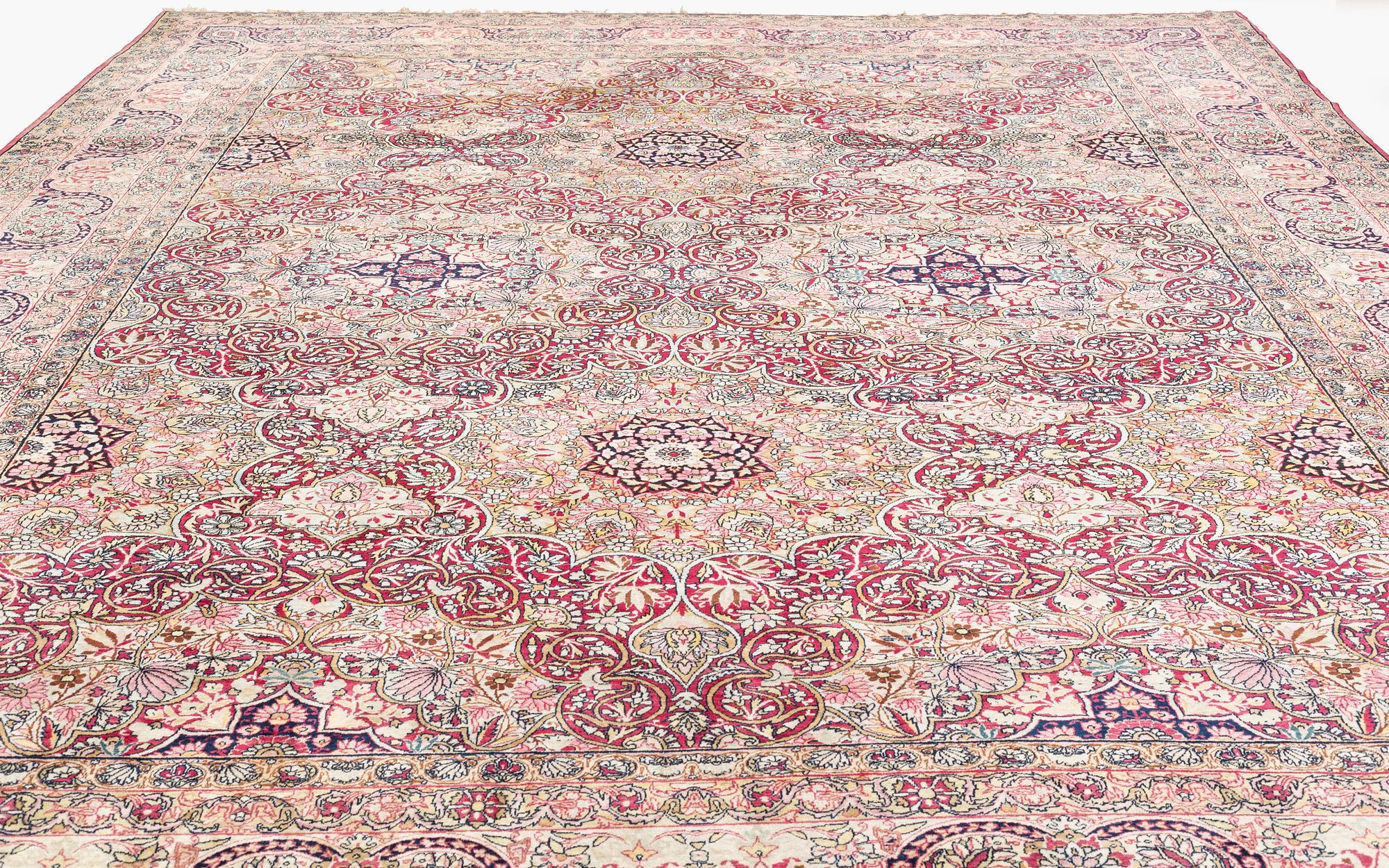 An antique Kerman Laver carpet, south east persia, ca 501 x 359 cm.