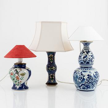 Three table lamps, porcelain and glazed earthenware, China and Europe, early 20th century.