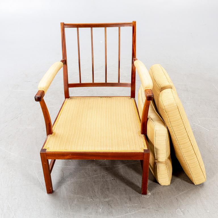A Josef Frank walnut armchair Firma Svenskt Tenn model nr 667.