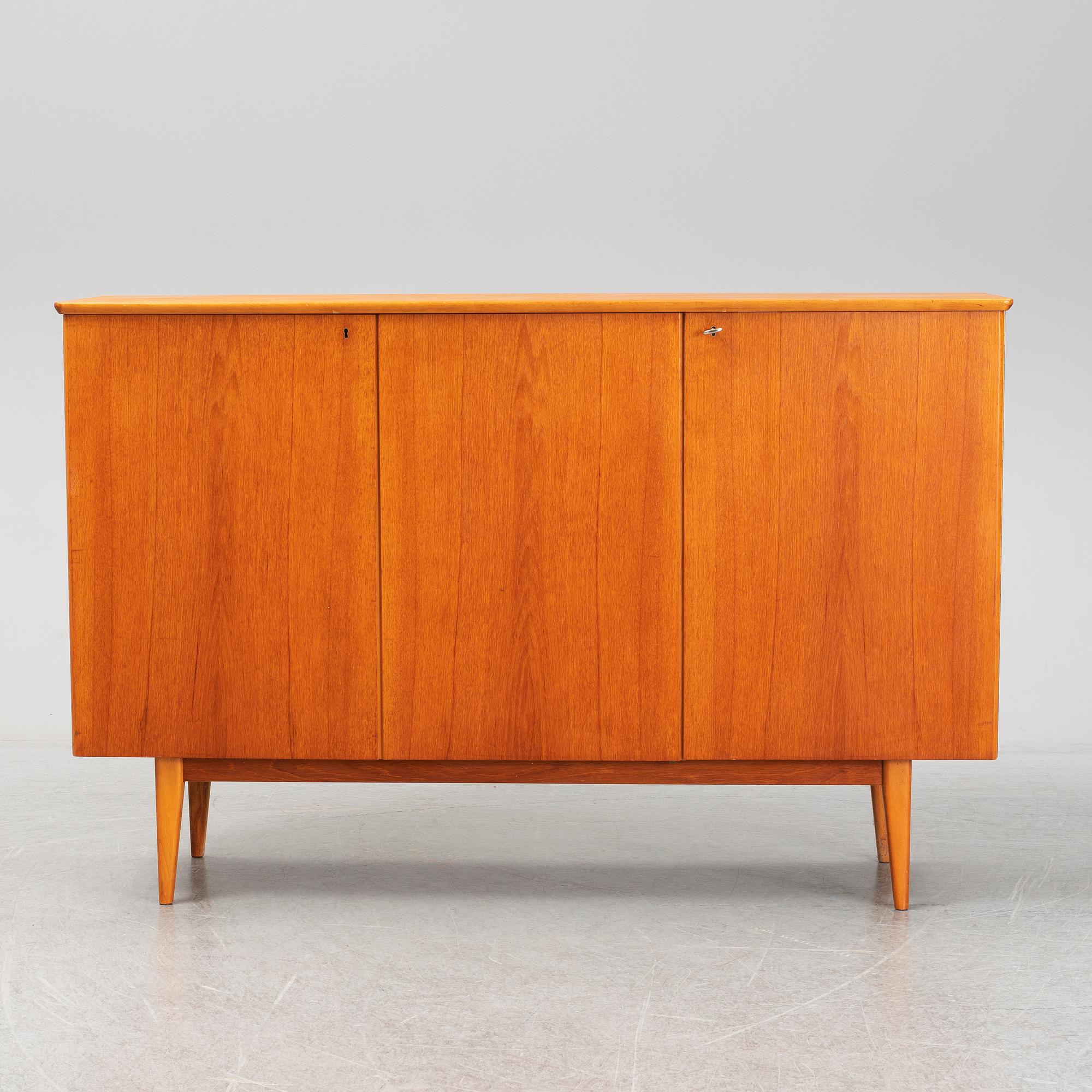 A mid 20th century teak veneered sideboard.