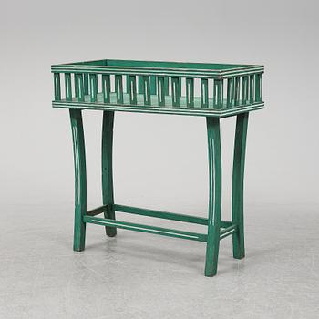 A painted plant stand, circa 1900.