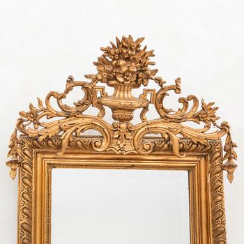 A Neo Rococo bronzed mirror around 1900.