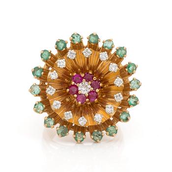 A brilliant cut diamond, emerald and ruby ring.