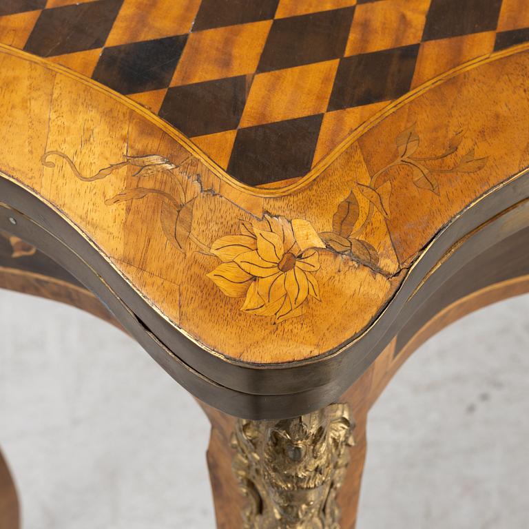A Louis XV-style games table, early 20th century.