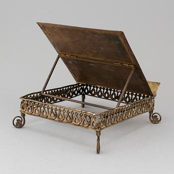 An 19th century brass book stand.