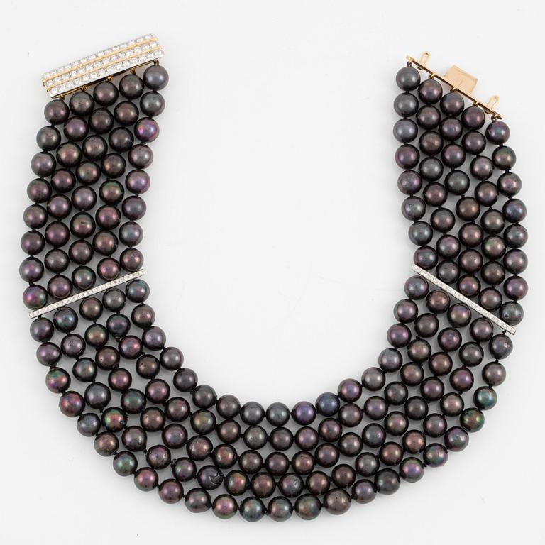 Necklace, five-row with cultured black pearls, 18K gold and white gold with brilliant-cut diamonds.