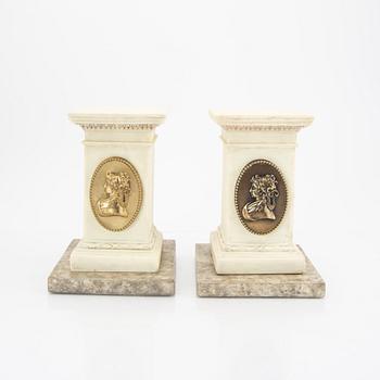 A pair of modern plaster statues of Napoleon.