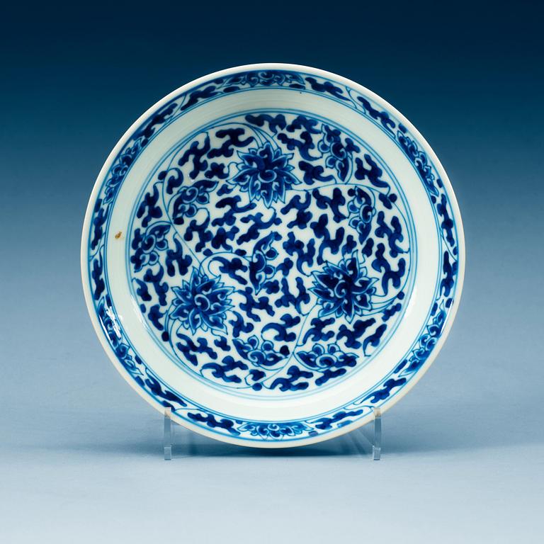 A set of four blue and white lotus dishes, Qing dynasty, with Kangxi six character mark.