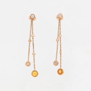 Yellow sapphire and brilliant-cut diamond earrings.