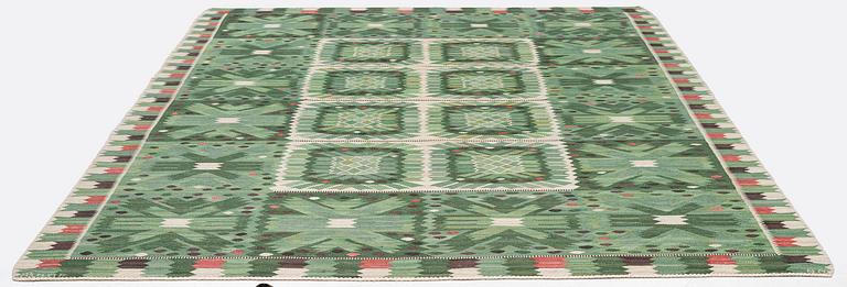 Barbro Nilsson, a carpet 'Nejlikan grön', flat weave, c. 390 x 278 cm, signed AB MMF BN.
