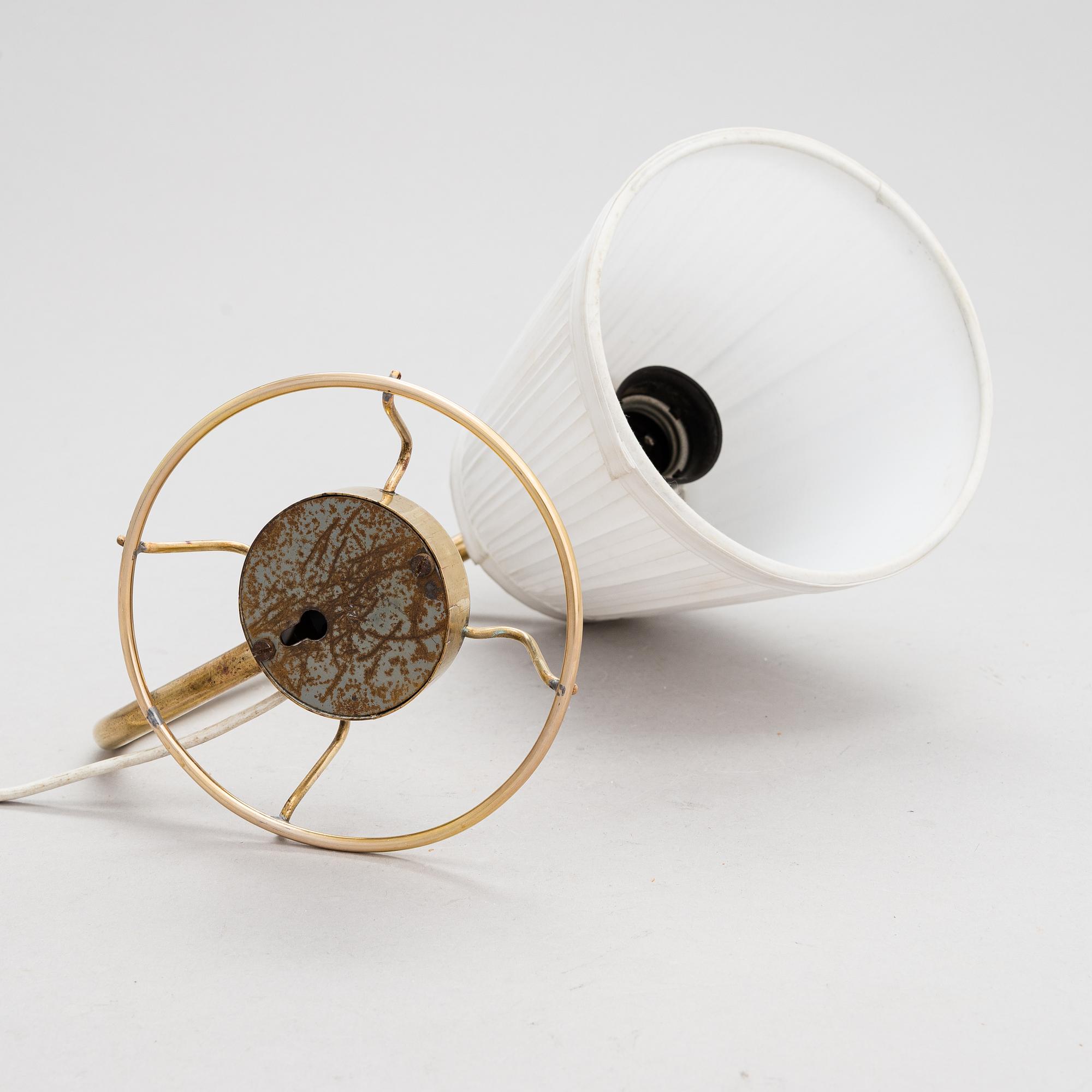 A mid-20th-century table lamp
/wall light for Idman.