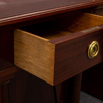 An early 20th century writing desk with chair.