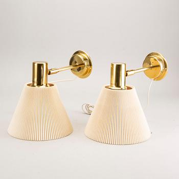 A pair of IKEA 1990s Stockholm brass wall lamps.