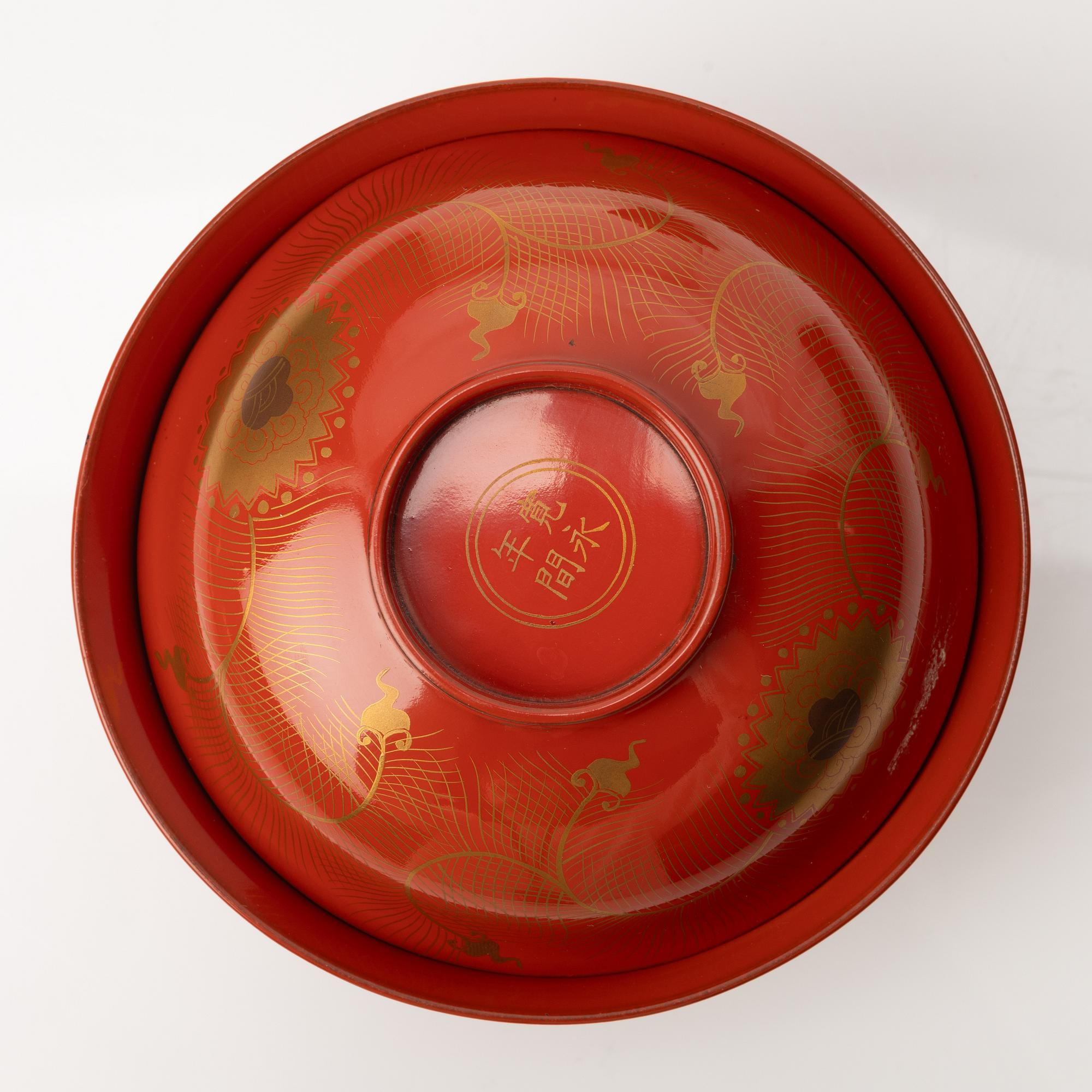 A group of nine Japanese lacquer bowls with covers, Meiji and 20th century.