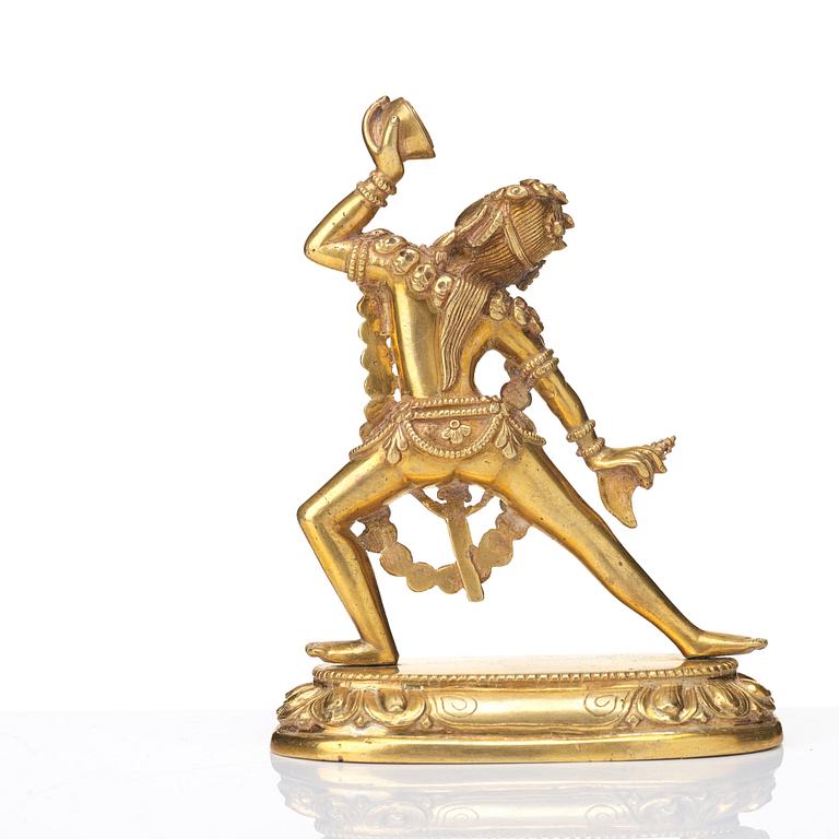 A gilt bronze figure of Dakini, Tibeto-Chinese, 19th Century.
