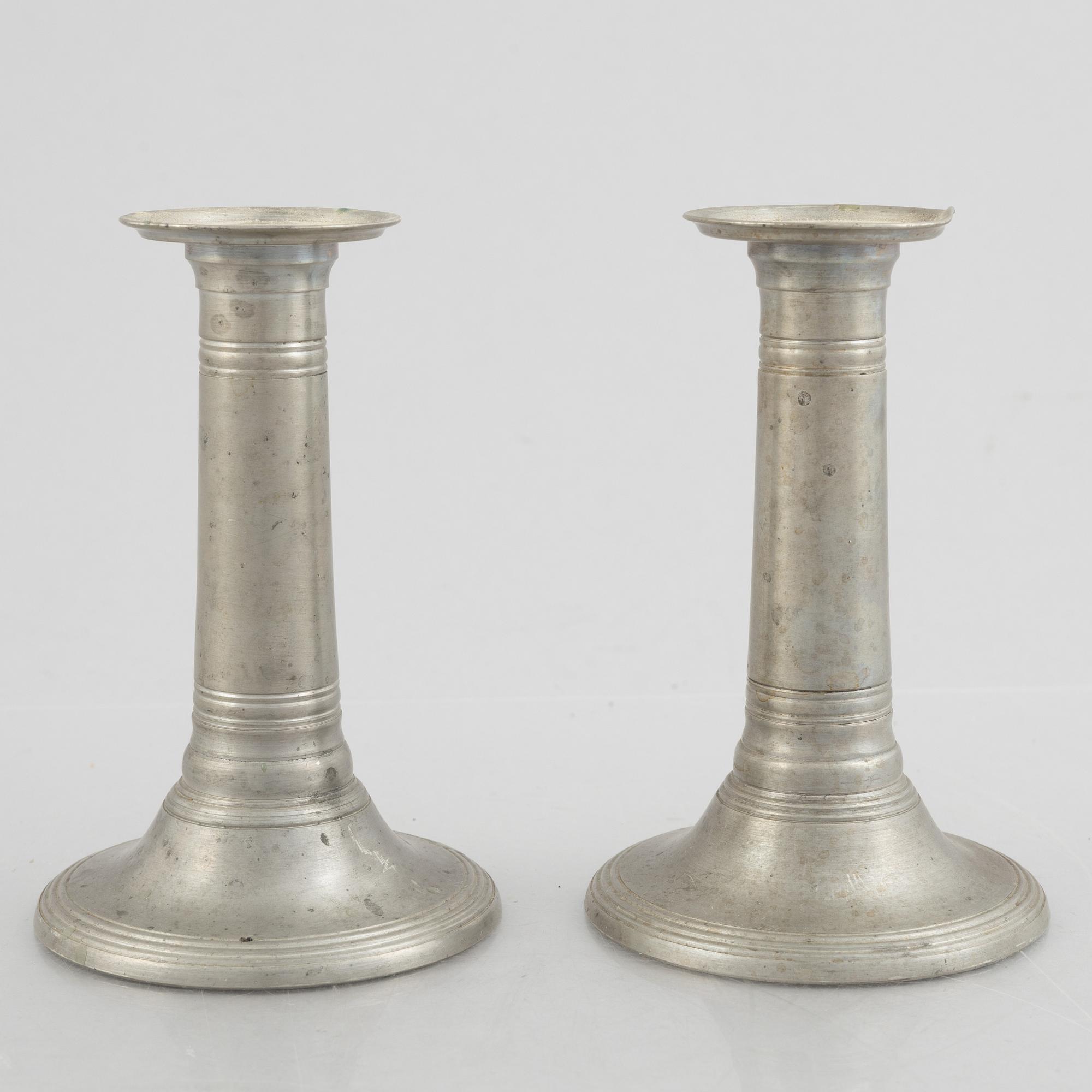 A pair of pewter candle sticks, model A702, Firma Svenskt Tenn, Sweden, 1928.