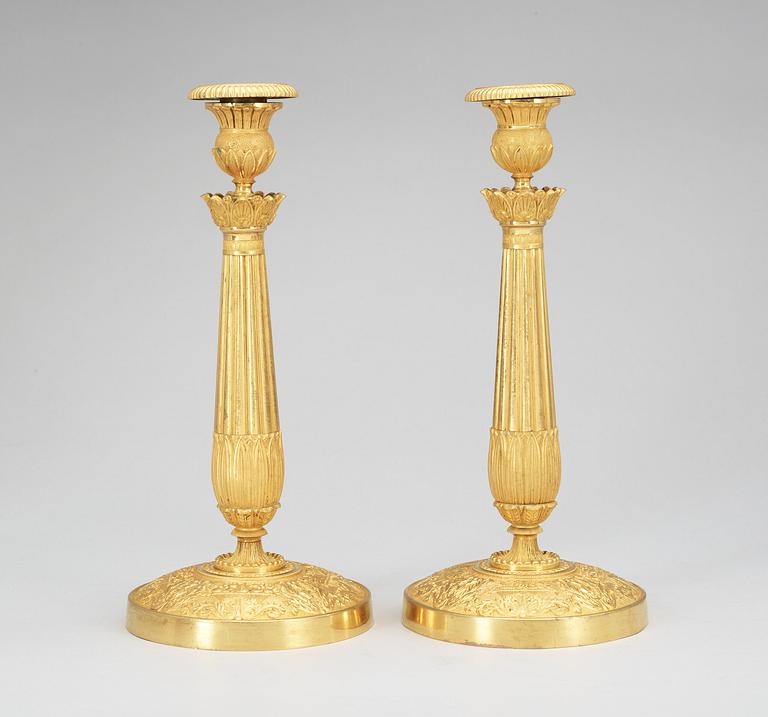 A pair of French late Empire first half 19th Century candlesticks.