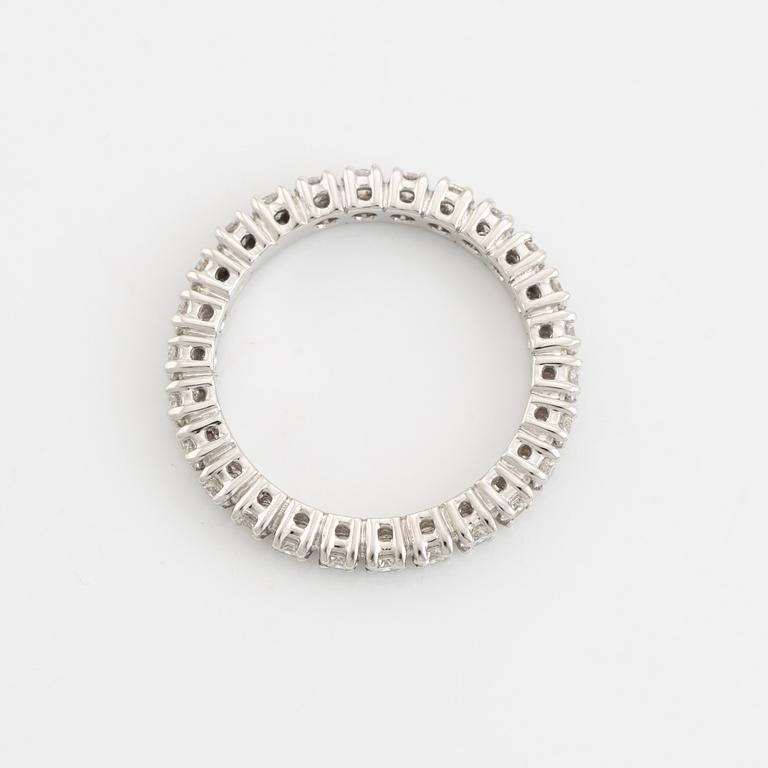 Brilliant cut diamond eternity ring.