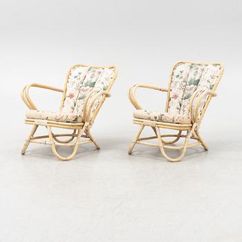 A rattan sofa, table and a pair of armchairs, second part of the 20th Century.